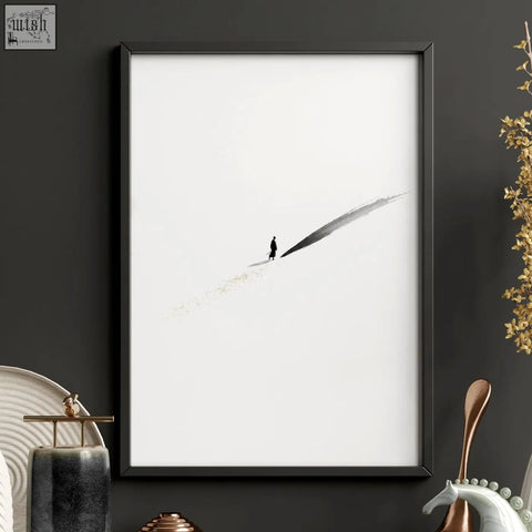 Black-framed japandi wall decor featuring a minimalist solitary figure on a dark gray brushstroke with gold-toned accents