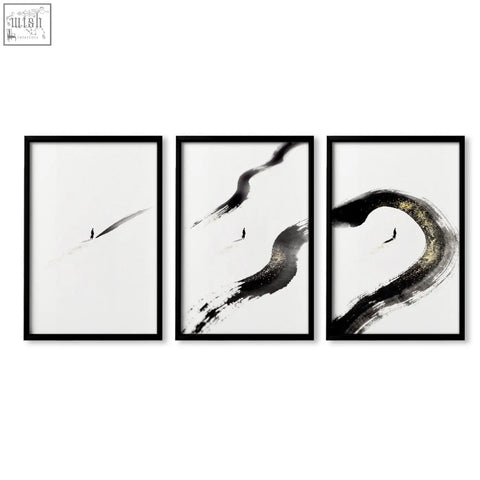 Set of three japandi wall decor prints with black ink brushstrokes and gold-toned accents in minimalist frames