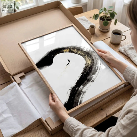 Minimalist japandi wall decor featuring black ink brush and gold accents on white paper in a light wood frame
