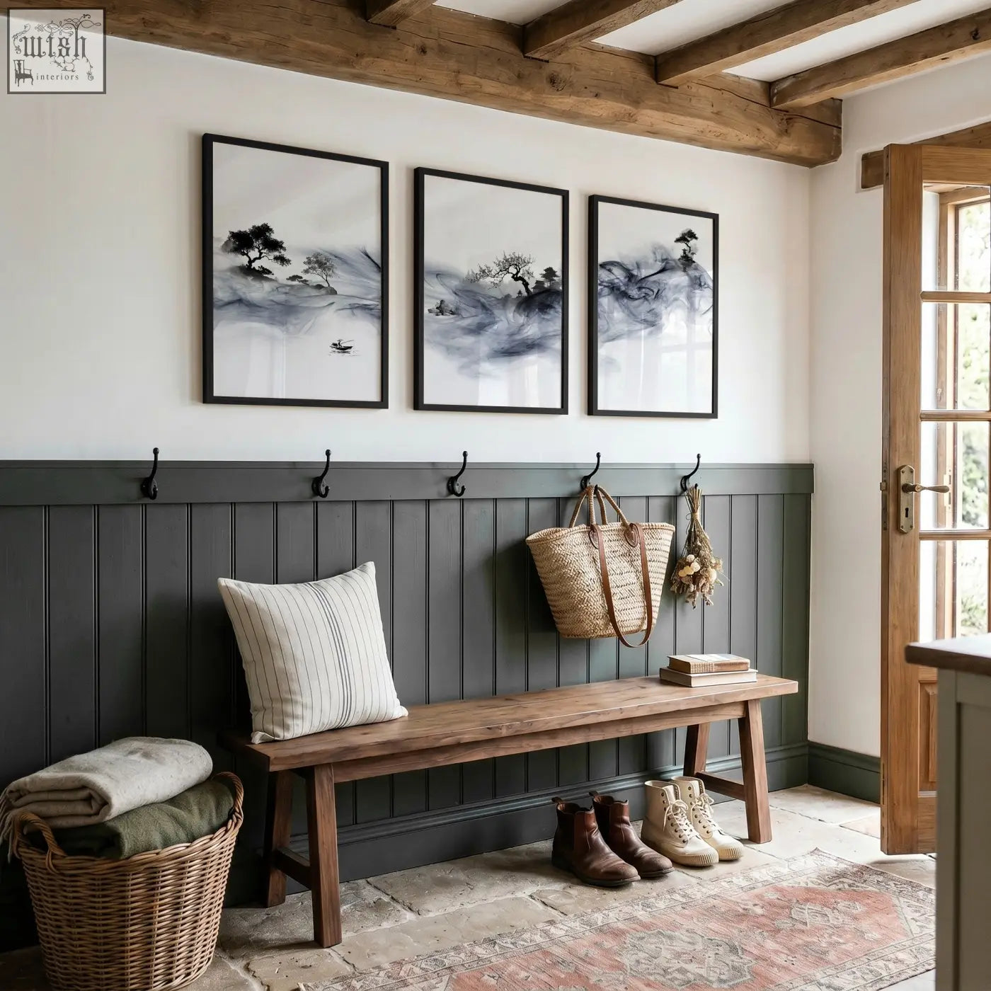 Dark gray wooden bench with striped pillow beside woven baskets in a room featuring ink wash landscape art prints set of 3
