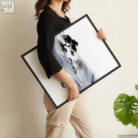 Black-framed minimalist art print of a stylized tree silhouette with soft gray and white ink wash landscape background
