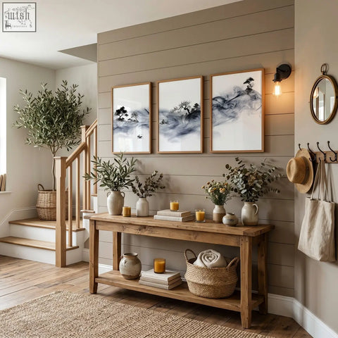 Rustic wooden console table with two shelves holding vases and books featuring ink wash landscape art prints set of 3
