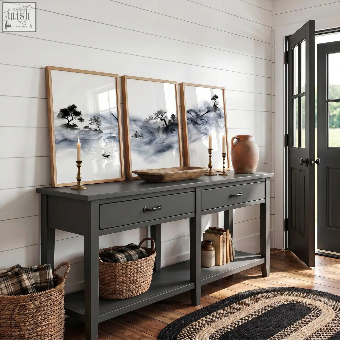 Dark gray console table with rustic wooden top and open shelves paired with ink wash landscape art prints set of 3