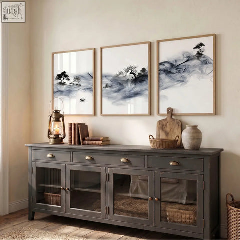 Dark gray rustic sideboard with glass cabinets and brass handles shown with japanese ink wash landscape art prints set of 3