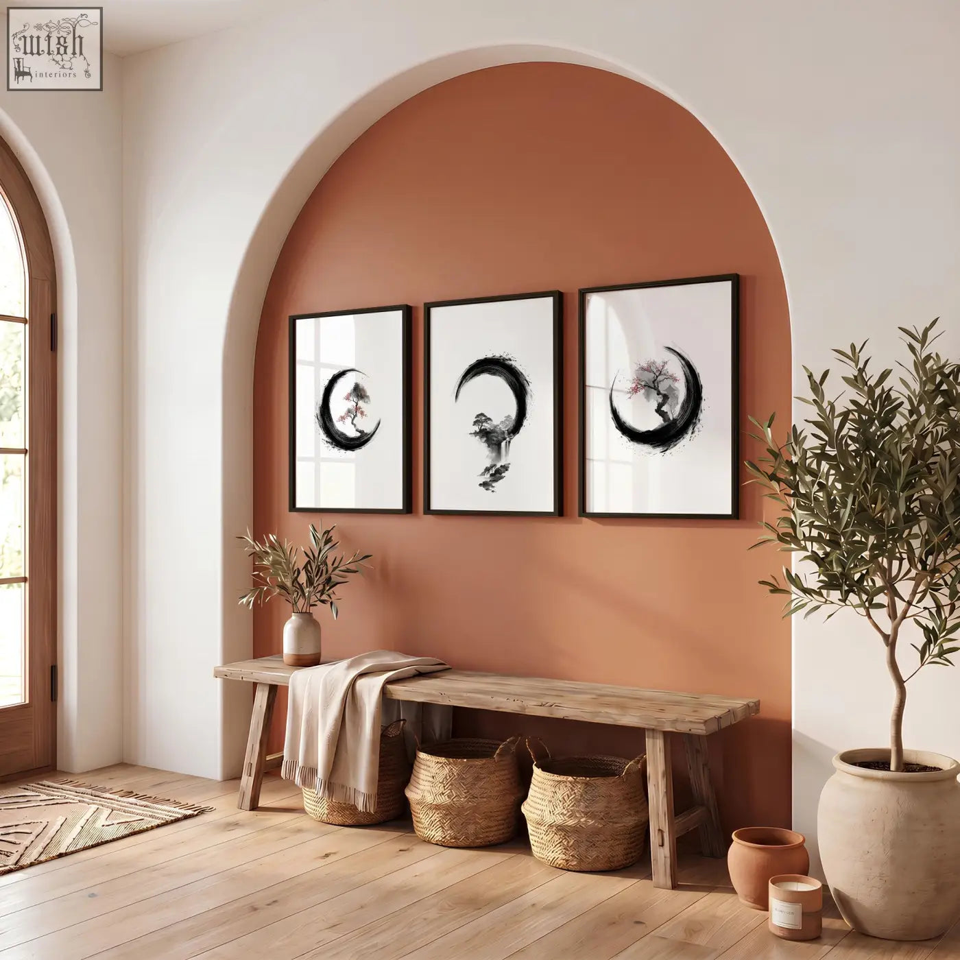 Three framed black and white japanese wall art ink paintings of crescent moons with floral motifs above a wooden bench