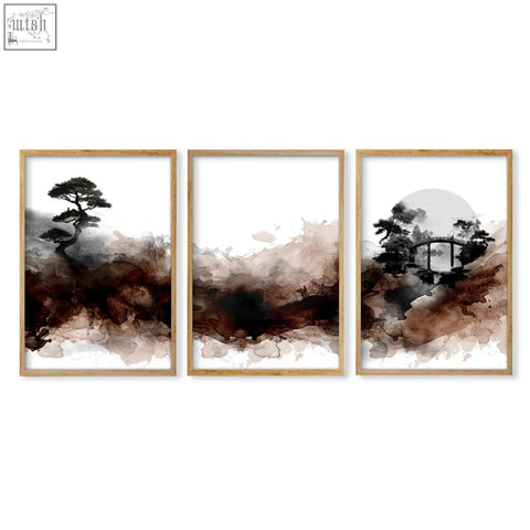 Set of three framed japanese wall art prints featuring ink wash landscapes in earthy brown black and white tones