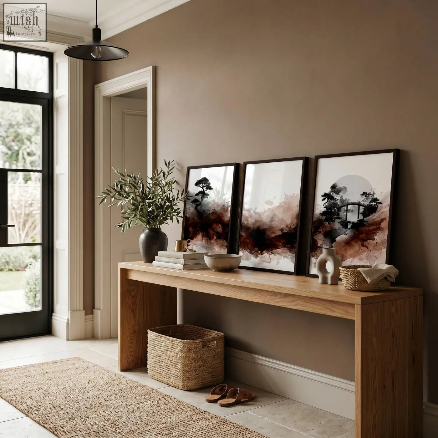 A minimalist wooden console table with natural finish under japanese wall art set featuring bonsai bridge and moon prints