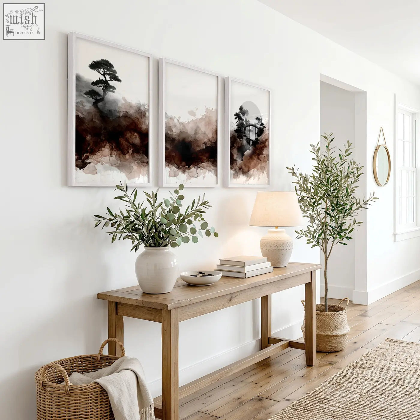A white ceramic vase with green eucalyptus branches complements japanese wall art bonsai bridge and moon prints set