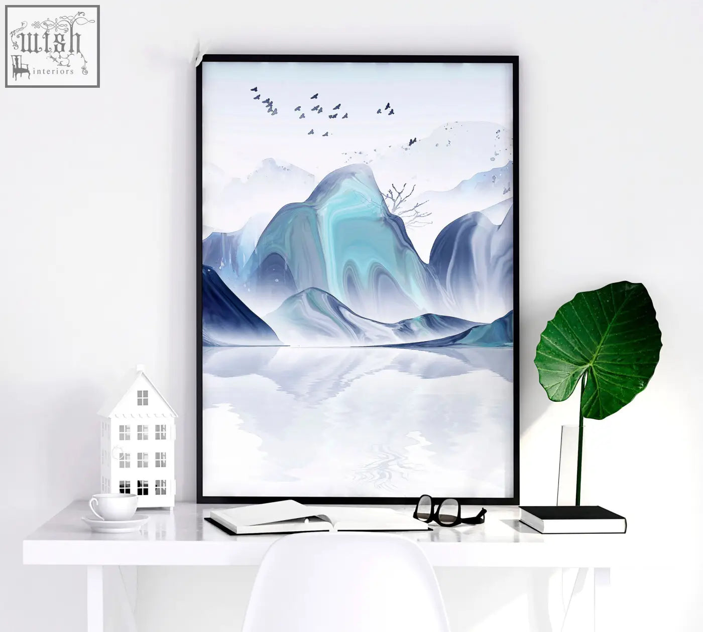 A framed minimalist japanese wall art print featuring teal and blue mountains reflected in calm waters with birds flying