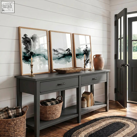 Dark gray console table with two drawers and rustic wooden top below japanese wall hangings ink wash landscape set of 3
