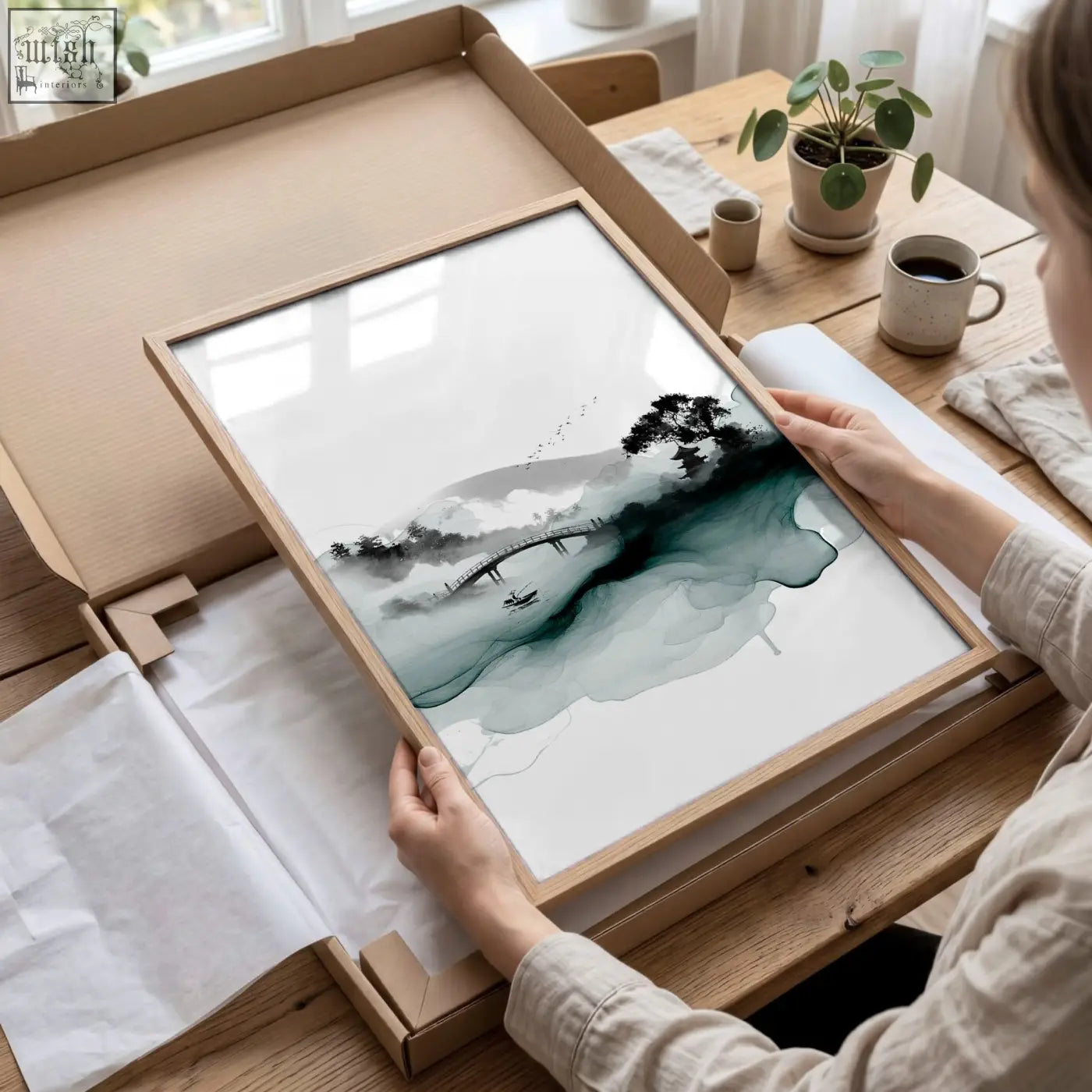 A minimalist framed japanese wall hanging featuring an ink wash landscape with misty mountains bridge and teal accents