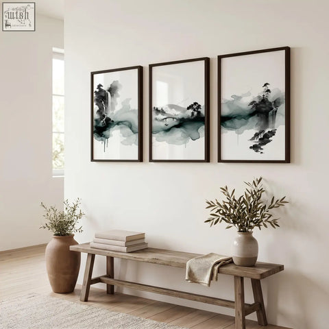 Three framed black and white japanese wall hangings ink wash landscape paintings above a rustic wooden bench