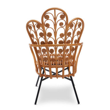 Java natural rattan scalloped back chair with peacock-inspired design and black metal legs showing the back side