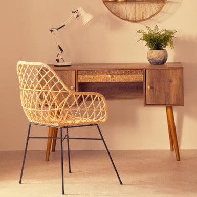 Java rattan chair with woven rattan seat and black metal legs perfect for indoor or outdoor use