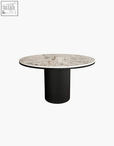 Jean round dining table with white marble top featuring gray veining and black ribbed pedestal base perfect for round dining