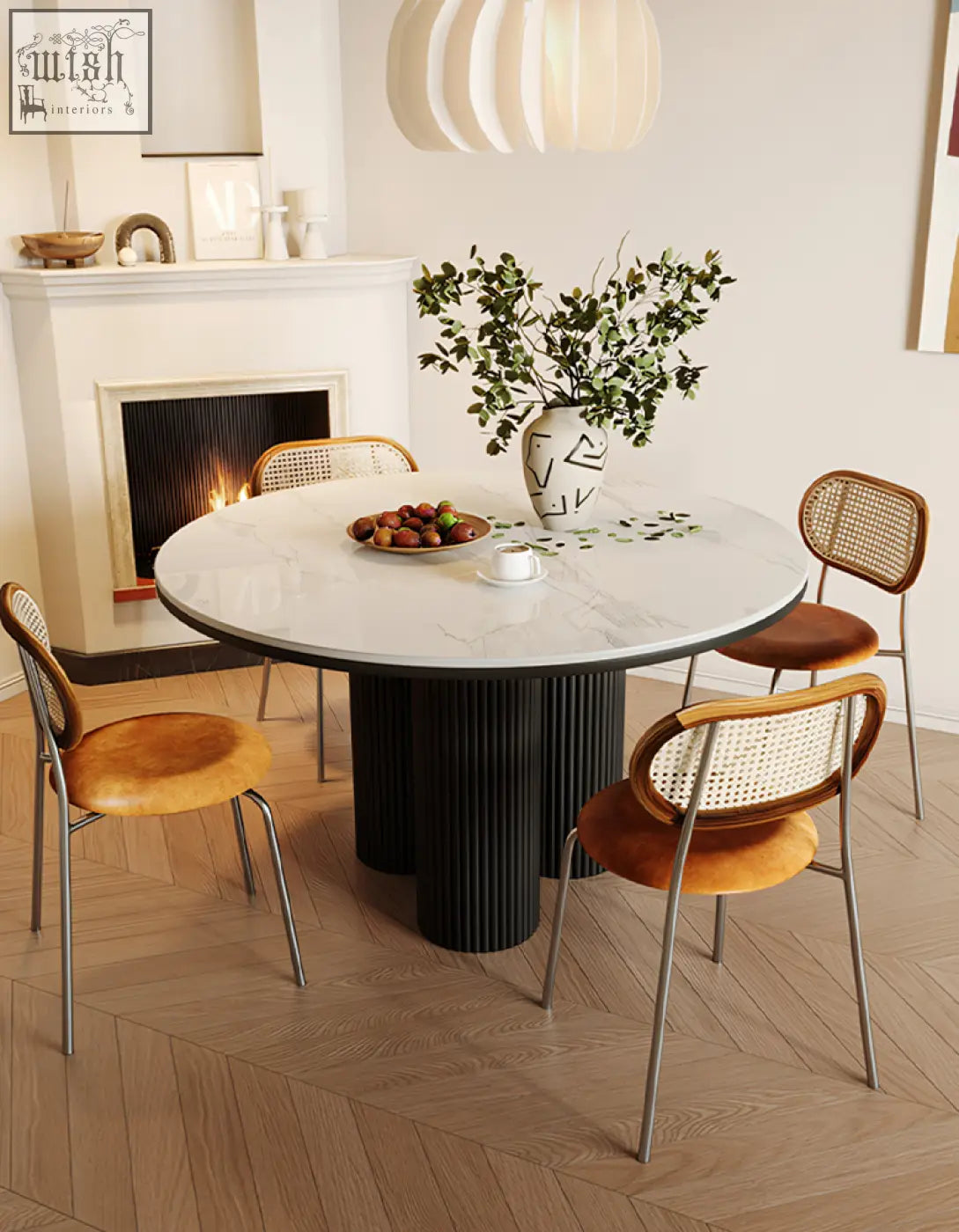 Jean round dining table with white marble top and black ribbed pedestal base perfect for round dining spaces