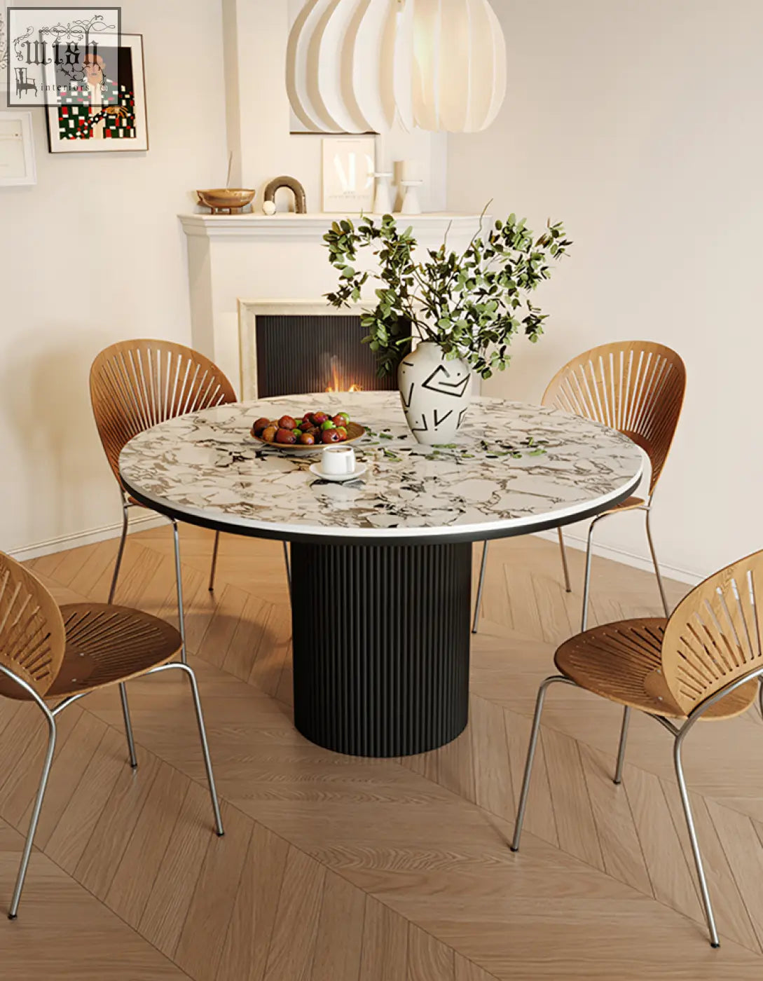 Jean round dining table with white marble top and black ribbed pedestal base perfect for round dining spaces