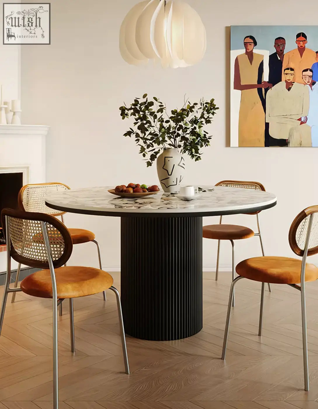 Round dining table with white marble top and black ribbed pedestal base perfect for stylish round dining spaces