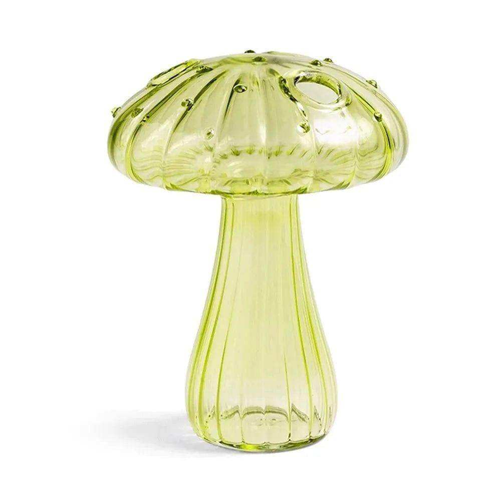 A translucent lime-green ribbed glass jelly mushroom vase with a central hole in the cap perfect for decor