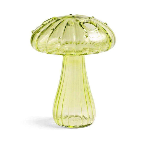 A translucent lime-green ribbed glass jelly mushroom vase with a central hole in the cap perfect for decor