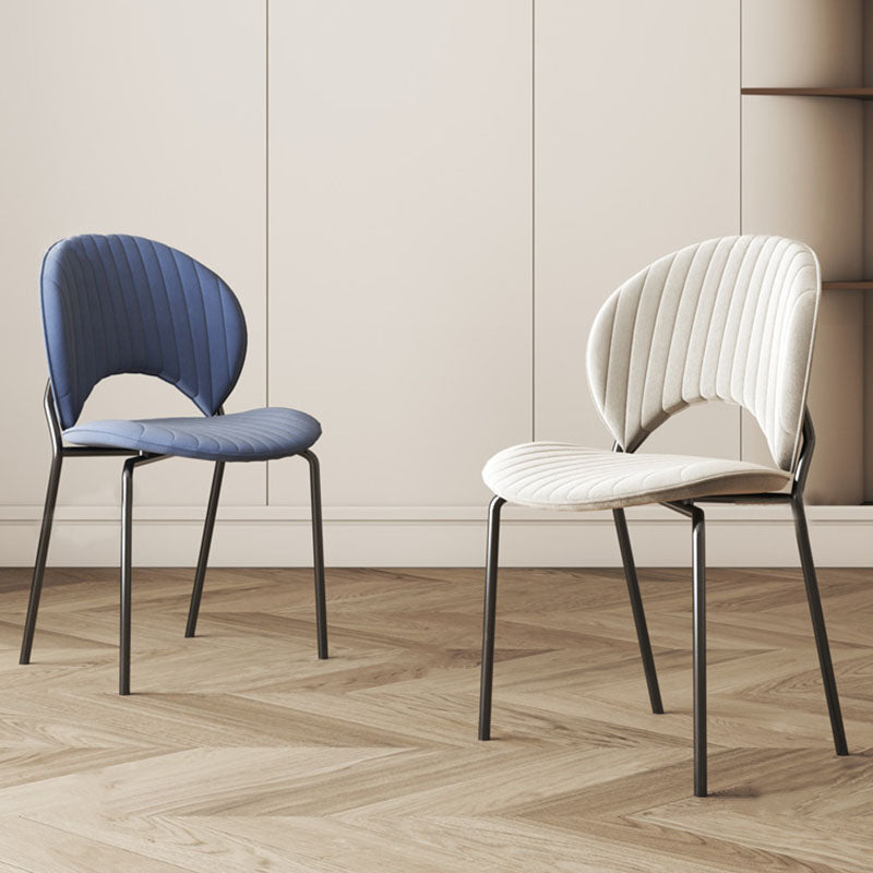 Blue and white velvet jerome dining chair with quilted ribbed seats and backs on sleek black metal frames
