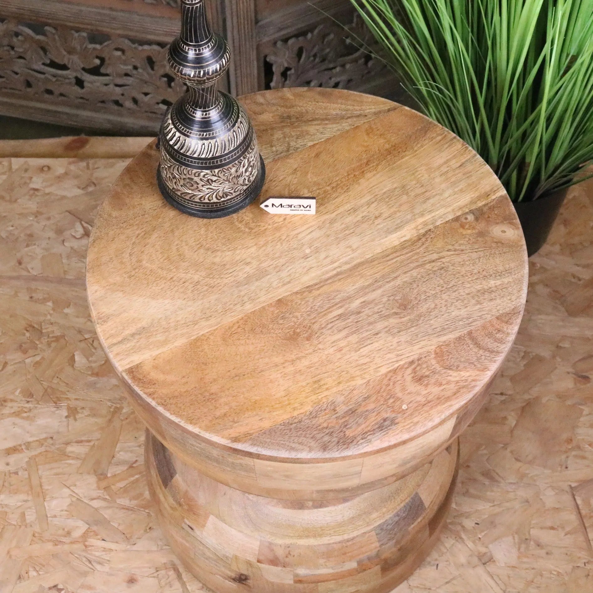 Round wooden side table with natural finish and stacked barrel design made from jivana mango wood