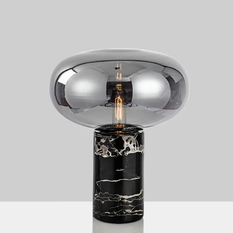 Modern table lamp johano light with reflective chrome glass dome and black marble base with white veining