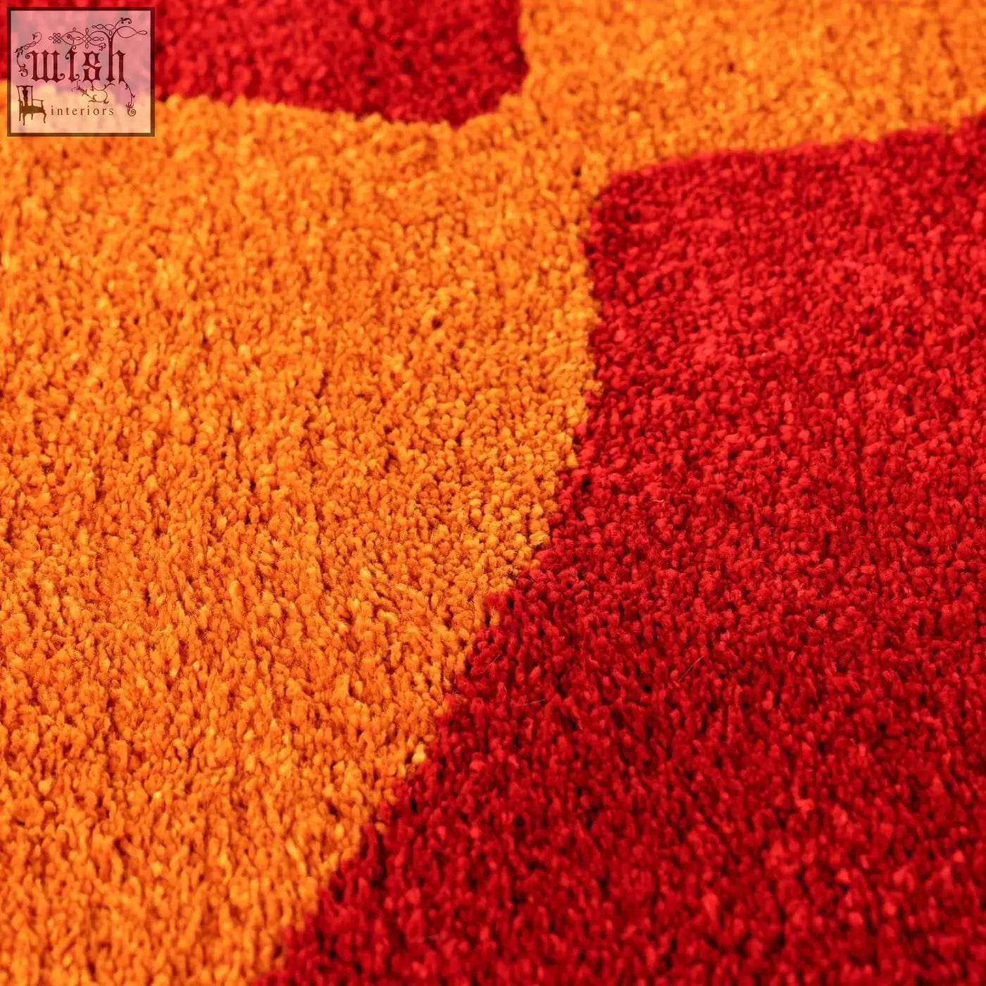 Vibrant orange and red geometric patterned plush jolI checkered red rug perfect for cozy home decor