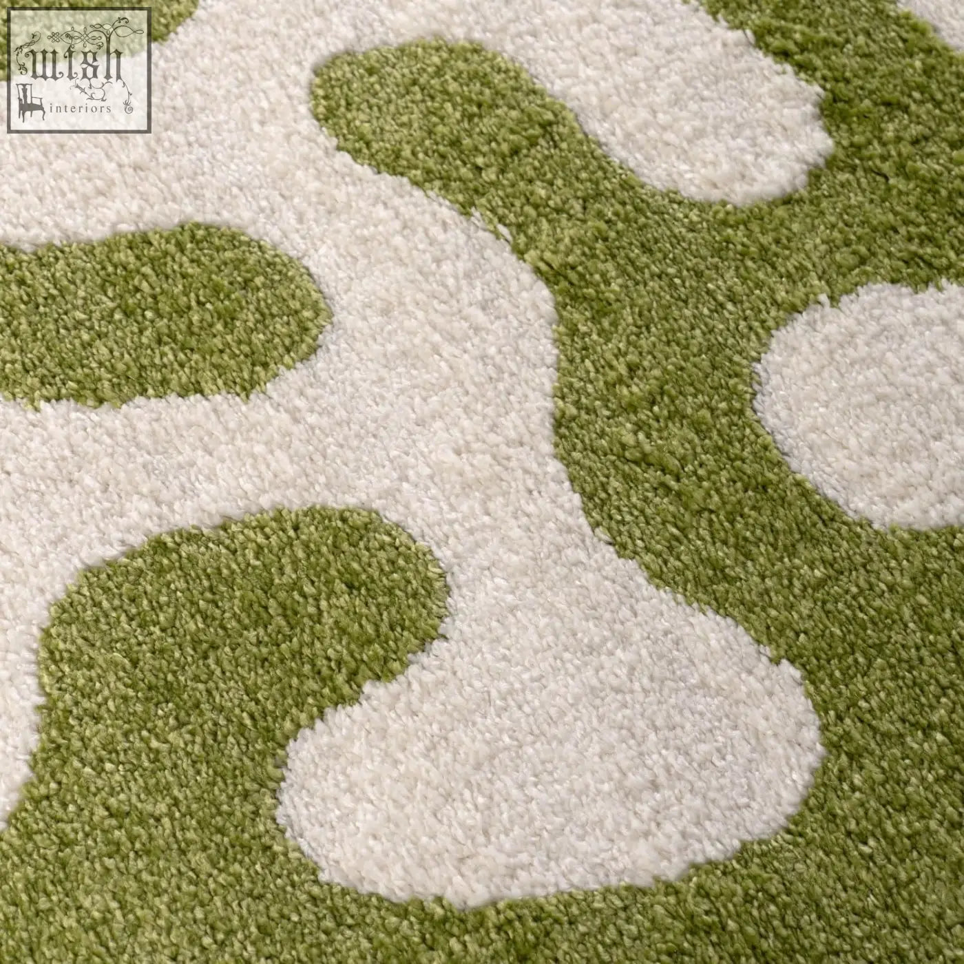 A soft shaggy joli doodle green and white rug with an abstract plush pattern perfect for cozy spaces