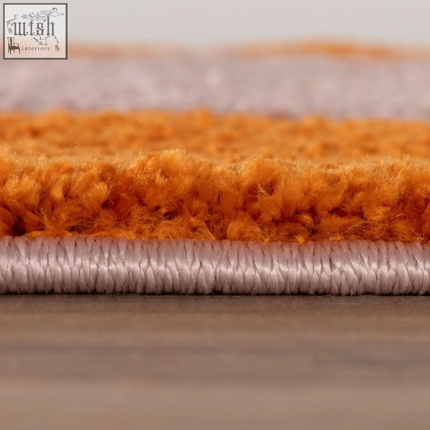 Orange and lavender striped plush rug with textured pile in joli doodle orange and pink style