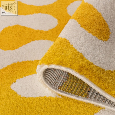 A plush soft textured joli doodle yellow and white rug with a cozy doodle yellow pattern perfect for any room