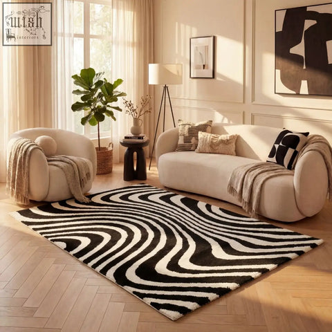 Black and white wavy patterned area rug featuring the joli striped black design perfect for modern decor