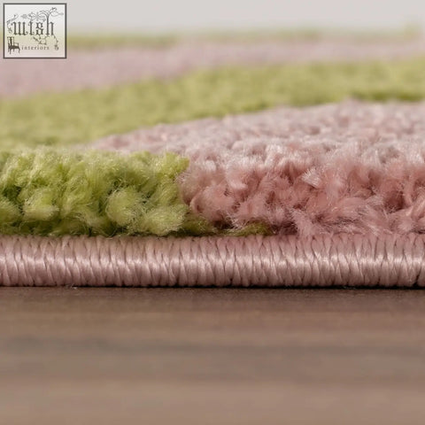 Pastel green and pink striped shaggy rug with plush texture called joli wave green perfect for cozy spaces