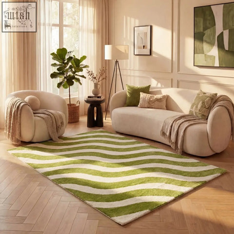 A plush rectangular joli wave green rug with bold wavy stripes in vibrant green and cream colors