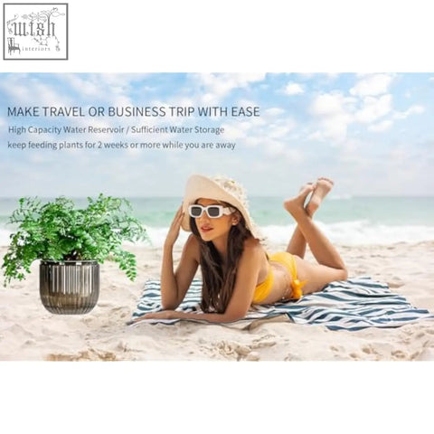 A sleek dark gray ribbed ceramic outer pot with visible water level holding a lush green plant for indoor hanging use