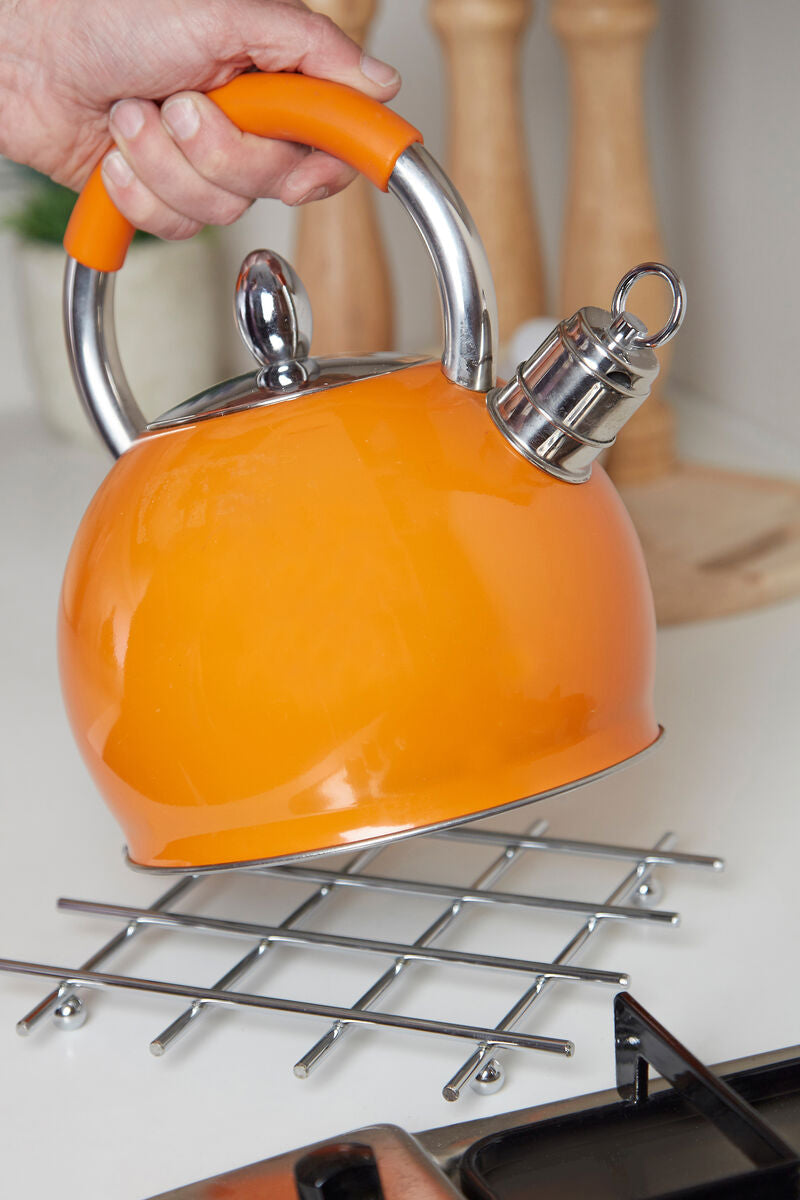 Vibrant orange enamel kettle with chrome wire trivet and ergonomic handle in jude heavy chrome heavy chrome wire design