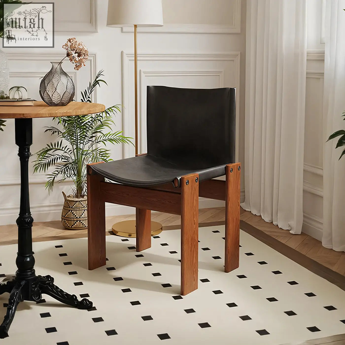 Black leather judith dining chair with wooden legs showing seat and backrest for stylish dining seating