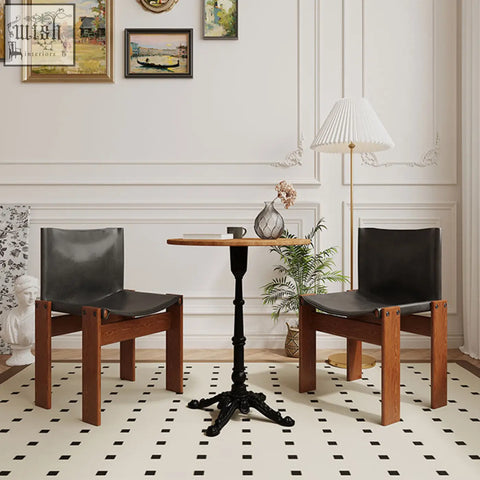 Black leather upholstered judith dining chair with solid wood frame perfect for stylish dining rooms