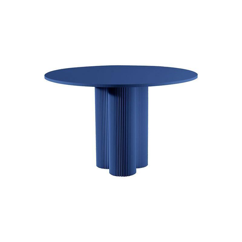 Julia round dining table with a solid navy blue finish and fluted pedestal base perfect for modern dining spaces