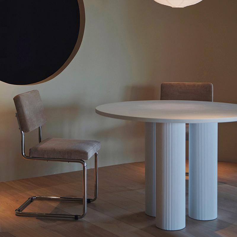 White round dining table with fluted cylindrical legs in the julia round dining collection