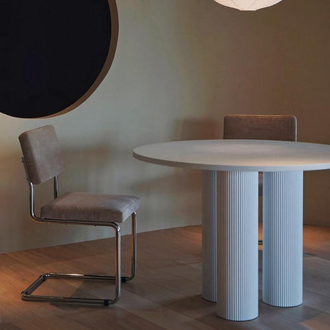 White round dining table with fluted cylindrical legs in the julia round dining collection