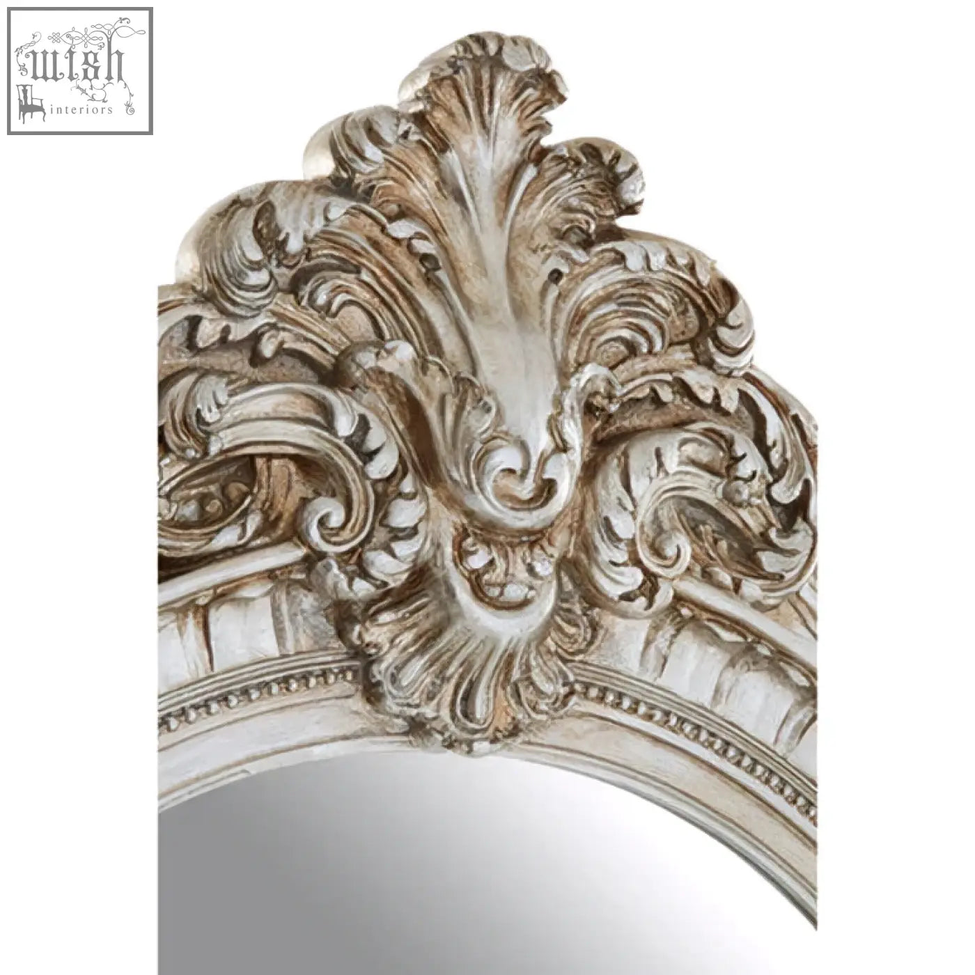 Antique-style silver champagne oval framed wall mirror with ornate scrollwork detailing for elegant decor