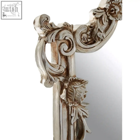 Antique-style juliet rectangular framed wall mirror with ornate silver floral and scrollwork detailing