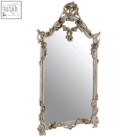 Silver ornate juliet rectangular framed wall mirror with intricate baroque carvings and decorative crest on top