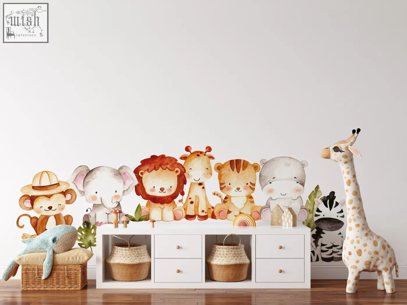 A charming collection of reusable jungle wall decals featuring cartoon safari animals in soft watercolor tones for kids rooms