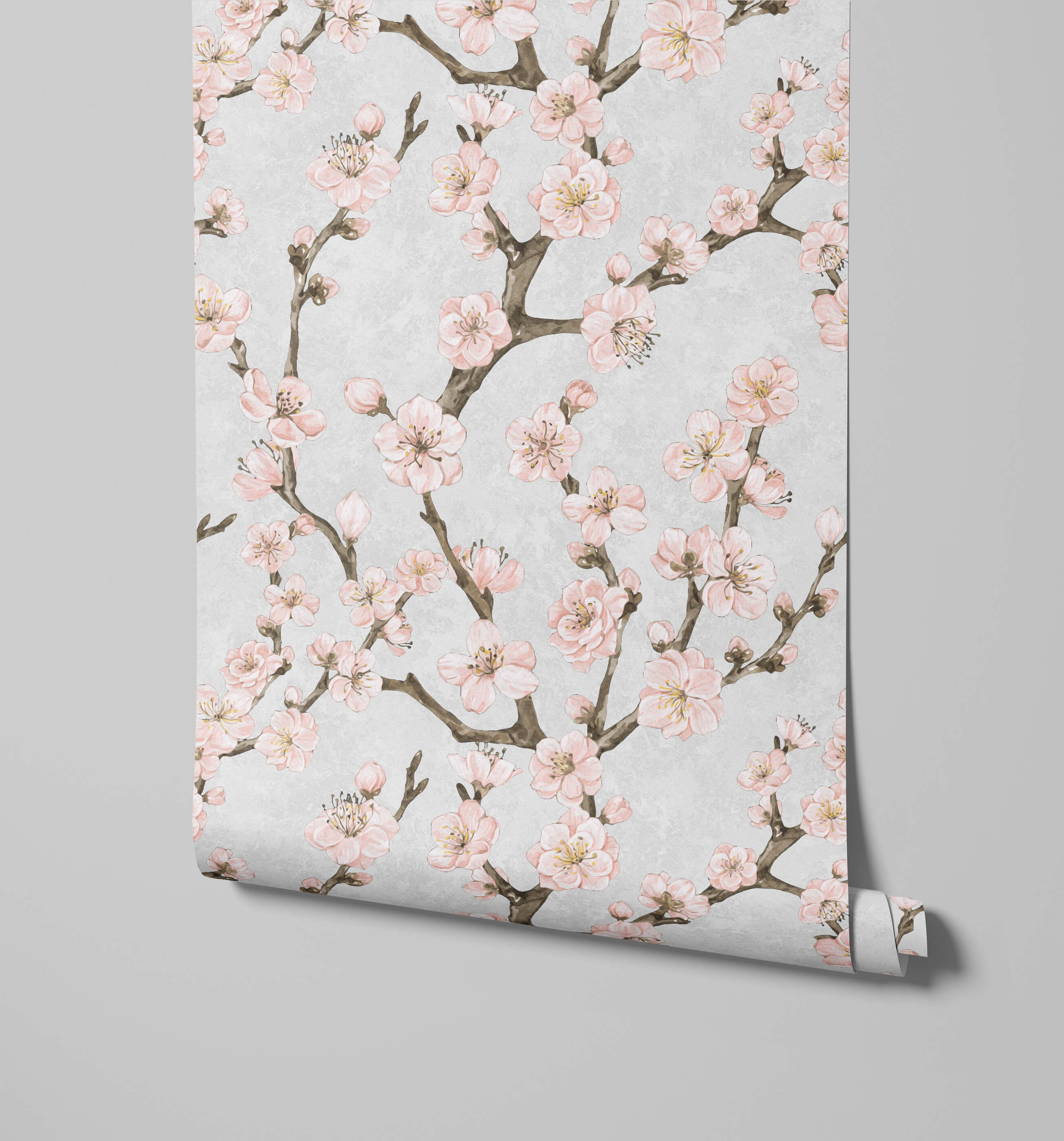 A roll of junta cherry blossom wallpaper with delicate pink flowers brown branches and soft yellow centers on gray background