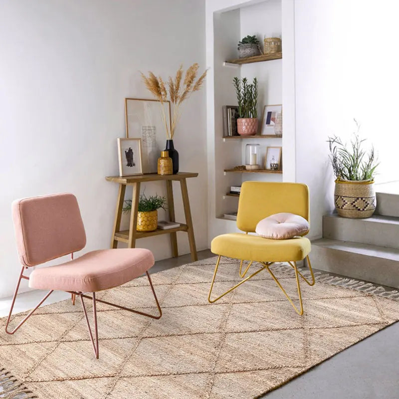 Yellow velvet armchair with gold metal legs and matching cushion shown alongside junya rug for stylish comfort