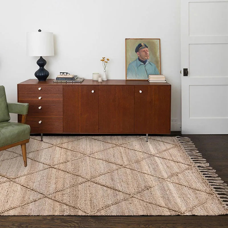 Beige woven jute junya rug with geometric diamond pattern and fringed edges perfect for cozy spaces