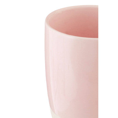 A sleek matte finish pink ceramic jura pink mug with a smooth rounded rim perfect for everyday use