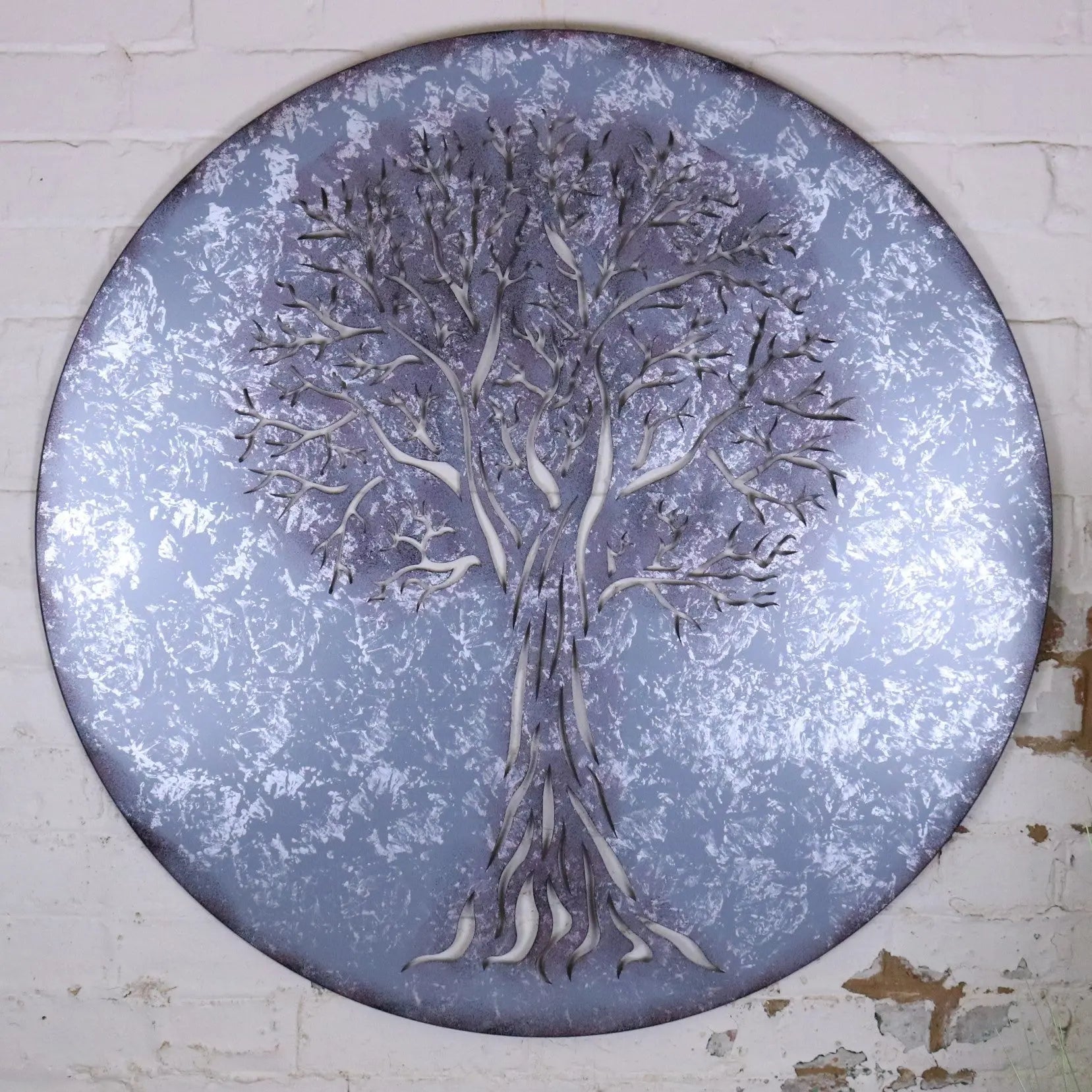 Kailora tree metal garden wall art 100cm featuring silver circular wall art with intricate tree design on gray background
